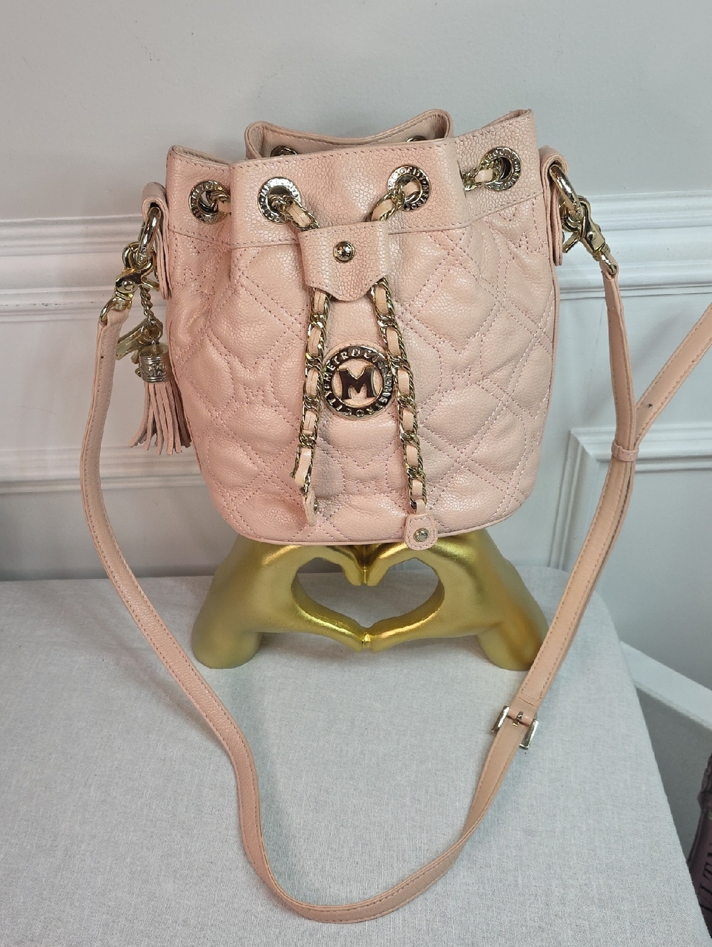Metrocity Quilted Leather Bucket Bag in a baby pink color